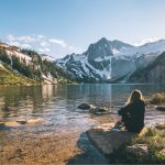 Colorado mountains with lake and person sitting down