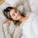 Girl waking up refreshed after taking CBN for sleep and insomnia